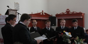 Members of the Theological Choir perform at a church in Buja, Romania