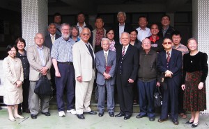 Elder Liau (front-centre) and the Hakka team celebrate the new Bible, April 2012.
