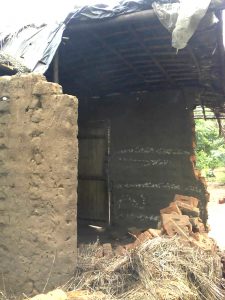 Profile of collapsed house Malawi village our son