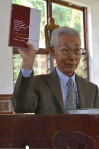 Kang with book