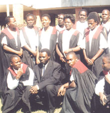 Alexander Kalimbira composes many of the songs his church's choir sings in Malawi. He's seen here (black suit) with the choir that sang at the University of Malawi's 2003 convocation.