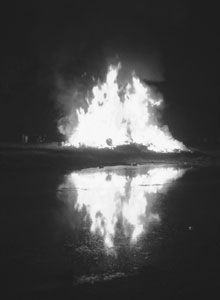 Flames Reflection: From Wick Gala days, the closing bonfire and its reflection in the Wick River.
