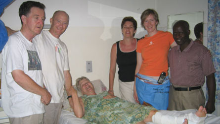 The mission team visits Annemarie at her hospital bed. From left, Gordon Timbers, Ian Fraser, Diana Veenstra, Karen Plater and Mwali, their driver.