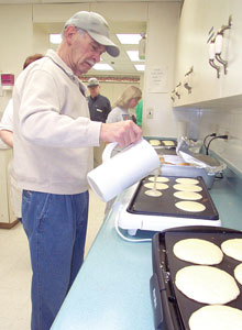Clayt Mifflin prepares pancakes for First, Chatham's breakfast outreach program.