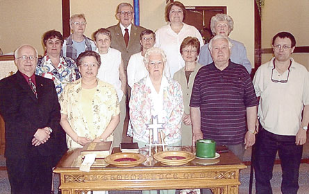 Mackay Presbyterian Church, Timmins, gathers for communion. From left, front: Norman Johns and Bertha Johns, lay ministers, with Doris Grebenjak, Neill Herron and Michael Fournier. Middle: Julie Karls, Valerie, MacNab, Organist, Marjorie Boyd, Lynn McColeman, Barbara Herron. Back: Irene Theyers, Ron Theyers, Anne Jensen. Photo - Don Perry