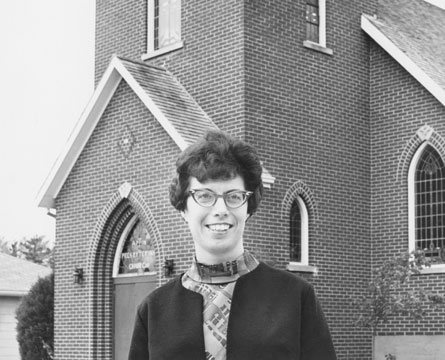 Photo - Sun Media Corp Rev. Shirley M. Jeffery, the first woman to be ordained as a minister of word and sacrament in The Presbyterian Church in Canada, standing in front of Appin Presbyterian Church, in 1968.