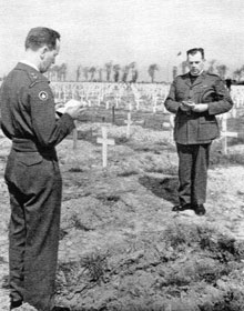 Padre Foote conducting a funeral of an unknown Canadian soldier at Bretteville-sur-Laize, Normandy