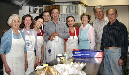 The Out of the Cold Tuesday Morning Community Breakfast teams prepare the bacon, eggs, pancakes, coffee, tea, orange juice and milk.  Photo - courtesy St. Andrew's, King Street, Toronto