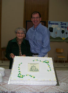 Good news often travels with company: take the story of First, Chatham, Ont. Katherine Lee has been a member there for 60 of the church's 174 years. And, Rev. Mike Maroney is happy to celebrate both events - as is that cake.