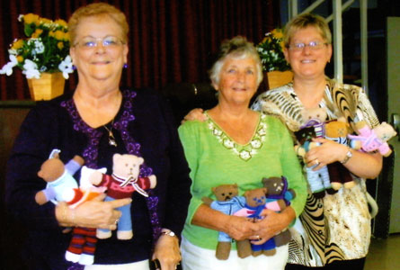 A Teddies for Tragedies tea was held at Duff's, Aberfoyle, Ont., in October. One Thousand, Two Hundred and Three bears were donated along with all the bears that came in during the year.  Mary Gatshene (left) is a nurse from Kitchener, who went to El Salvador with Short Term Medical Group. She said the Teddies were a great help when treating children. Liz McCrindle (middle) is co-ordinator of Teddies for Tragedies. And, Helen Stewart (right) is a teacher from Milverton who went to Nicaragua with Presbyterians Aiding Nicaragua. She said some children there have never had a doll before.