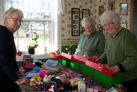 Betty Langille, Jean Nelson and Elizabeth Allen, St. John's, Pugwash, N.S., packing Shoe Boxes for needy children in the Ivory Coast.