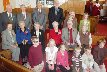 Raise a joyful noise: The senior's and children's choirs join together to sing their hallelujahs, at Knox, Finch, Ont.. Back, Gordon MacIntryre, Delburn Baker, Arnot Empey, Hugh MacDougall. Seated: Shelagh MacDougall, Norma MacIntyre, Catherine MacLean, Gladys Sangster, Fred Sangster, Lily Lowe and the Sunday School Members.