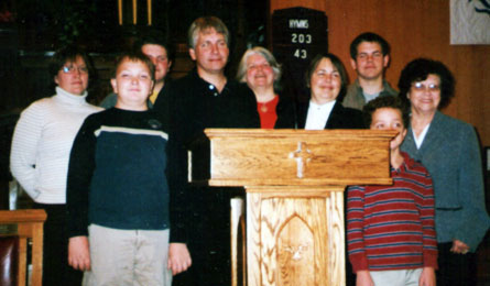Cake of the Month: St. Andrew's, Welland, Ont. celebrated its 175th anniversary in January. Members of the congregation surround the new lectern, crafted by Stewart Cramp: Bonnie Cramp, Ike Hunt, Stewart Cramp, Judy Hunt, Elaine Anderson, Nathan Hunt, Jeanette Cramp; front, Steven and Andrew Cramp. Happy Birthday!