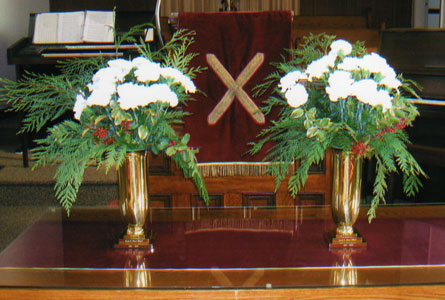 New St. Andrew's, Dover, in Chatham Kent, Ont., remembered Dave Millard, who died too early from injuries suffered in an accident, with a pair of engraved brass flower urns. From left: Dave's wife Janet Millard; brother Bob Millard; Pastor Mark Aarssen; along with other members of the Millard family.