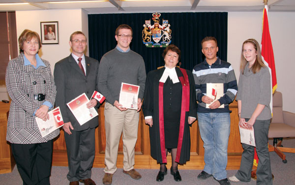 Dayspring, Edmonton is pleased to announce that the Grosskopf family became Canadian citizens in February. From left to right are Mrs. Carina Grosskopf, Rev. Dr. Heinrich Grosskopf, sons Paul and James, and daughter Carin, along with the judge who blessed them into their new country. Rev. Grosskopf was inducted as minister of Dayspring in September 2007. They came to Canada from South Africa in 2004.
