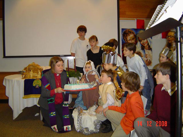 In December, Faith Fort McMurray, Alta., held its Sunday morning Christmas pageant and surprised the minister, Rev. Lisa Aide with a birthday cake. The young people in the pageant helped her blow out her candles.
