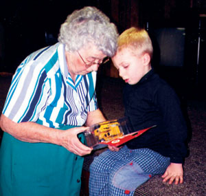 Great-grandma admires a Christmas present