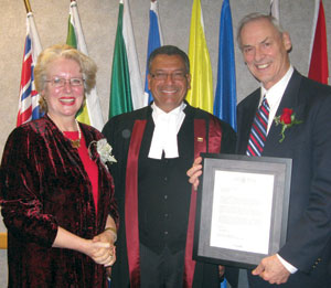 Hildy Stollery and Rev. Dr. Art Van Seters receive a thank you from Judge Raminder Gill.