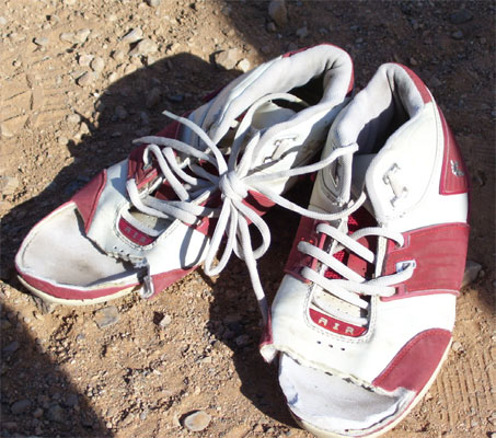 A set of sneakers abandoned in the desert.