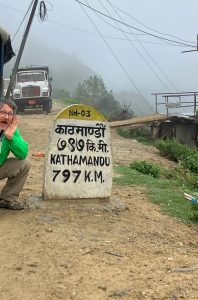 Mitch beside Kathamandu sign