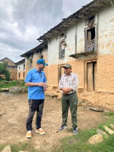 Two men standing in front of building