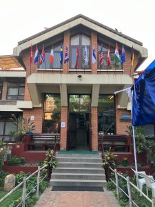 Building front with flags above
