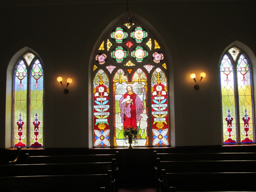 Trio of stained glass windows at back of church St. Andrew's